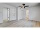 Spacious bedroom with sleek floors, ceiling fan, and modern lighting fixture at 1641 K St, Las Vegas, NV 89106