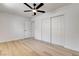 Bedroom featuring closet, ceiling fan, and light wood flooring at 1641 K St, Las Vegas, NV 89106