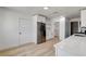 Modern kitchen featuring stainless steel appliances, white cabinets and light wood flooring at 1641 K St, Las Vegas, NV 89106
