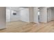 Open-concept living room with white walls and modern light wood flooring at 1641 K St, Las Vegas, NV 89106