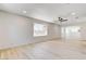 Bright living room with white walls, recessed lighting and light wood flooring at 1641 K St, Las Vegas, NV 89106