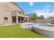 A backyard featuring a pool, a patio, and artificial grass at 176 Dunblane St, Henderson, NV 89012