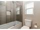 Bathroom featuring a bathtub with a shower and a toilet at 176 Dunblane St, Henderson, NV 89012