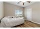 A bedroom with a ceiling fan, window, and a white door at 176 Dunblane St, Henderson, NV 89012