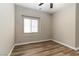 This bedroom features a ceiling fan and a window at 176 Dunblane St, Henderson, NV 89012