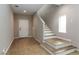 Bright and airy foyer featuring tile floors, staircase, and natural light, creating a welcoming entrance at 176 Dunblane St, Henderson, NV 89012