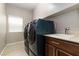 A laundry room featuring a washer, a dryer, and a sink at 176 Dunblane St, Henderson, NV 89012