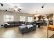 Spacious living area with a large sectional sofa, ceiling fan, recessed lighting, and open concept design at 176 Dunblane St, Henderson, NV 89012