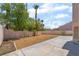 Private backyard with decorative rock and block wall fencing, plus a concrete patio at 1804 Michael Ct, Henderson, NV 89014