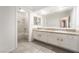 Spacious bathroom featuring double sinks with granite counters and a shower and tub combo at 1804 Michael Ct, Henderson, NV 89014