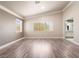 Bright bedroom with wood-style flooring, two windows, and neutral walls at 1804 Michael Ct, Henderson, NV 89014