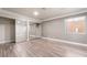 Bright bedroom boasts light-colored walls, wood-look flooring, and a mirrored closet at 1804 Michael Ct, Henderson, NV 89014