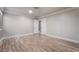 Neutral bedroom featuring light walls, bright trim, double doors and wood-look flooring at 1804 Michael Ct, Henderson, NV 89014