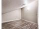 This bonus room features wood-look floors and a pitched ceiling at 1804 Michael Ct, Henderson, NV 89014