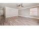 Open bonus room with ceiling fan, hardwood floors and a large window at 1804 Michael Ct, Henderson, NV 89014