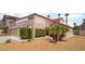 Charming one-story home featuring well-manicured landscaping and a two-car garage at 1804 Michael Ct, Henderson, NV 89014