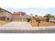Charming two-story home featuring a terracotta roof, dual garage, and low-maintenance desert landscaping at 1804 Michael Ct, Henderson, NV 89014