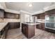This spacious kitchen features stainless steel appliances and a granite-topped center island at 1804 Michael Ct, Henderson, NV 89014