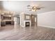 Open concept living area with hardwood floors, recessed lighting and a cozy fireplace at 1804 Michael Ct, Henderson, NV 89014