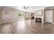 Bright living room with a fireplace, sliding glass doors to backyard, and wood-style flooring at 1804 Michael Ct, Henderson, NV 89014