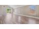 Bright living room showcasing sleek floors, multiple windows, and a sliding glass door at 1804 Michael Ct, Henderson, NV 89014