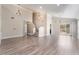 Spacious living room with high ceilings, lots of light, and hardwood floors leading to a staircase at 1804 Michael Ct, Henderson, NV 89014