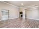 Spacious main bedroom with wood-style flooring, neutral walls and access to bathroom at 1804 Michael Ct, Henderson, NV 89014