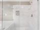 Close up of the glass enclosed shower with white marble style tile at 1804 Michael Ct, Henderson, NV 89014