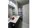 Bathroom with a vanity, mirror, shower curtain, and tiled flooring at 1830 N Buffalo Dr # 2021, Las Vegas, NV 89128