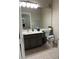 Clean bathroom with modern vanity, large mirror, and neutral décor at 1830 N Buffalo Dr # 2021, Las Vegas, NV 89128