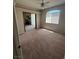 Bedroom featuring neutral carpeting and an open doorway to another room at 1830 N Buffalo Dr # 2021, Las Vegas, NV 89128