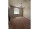 Bedroom with neutral colored carpet, a ceiling fan, and a window with blinds at 1830 N Buffalo Dr # 2021, Las Vegas, NV 89128
