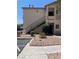 Charming two-story condo with stucco exterior, private balconies, and low-maintenance desert landscaping at 1830 N Buffalo Dr # 2021, Las Vegas, NV 89128