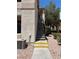 Exterior view of a two-story condo with private balconies and exterior stairs at 1830 N Buffalo Dr # 2021, Las Vegas, NV 89128