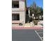 Exterior view of a two-story condo with private balconies and exterior stairs at 1830 N Buffalo Dr # 2021, Las Vegas, NV 89128