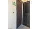 Brown front door of home with address number '2021' and a security screen at 1830 N Buffalo Dr # 2021, Las Vegas, NV 89128