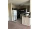 Open kitchen featuring gray cabinets, granite counters, and stainless steel appliances at 1830 N Buffalo Dr # 2021, Las Vegas, NV 89128