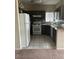 Bright kitchen with gray cabinets, granite counters, and stainless steel appliances at 1830 N Buffalo Dr # 2021, Las Vegas, NV 89128