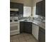 Well-equipped kitchen with stainless steel appliances, granite countertops, and ample cabinet space at 1830 N Buffalo Dr # 2021, Las Vegas, NV 89128