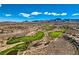 Picturesque golf course with rolling hills, scenic mountain views, and well-maintained greens at 2188 Cumberland Hill Dr, Henderson, NV 89052
