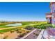 Charming outdoor patio overlooking a beautiful golf course and lake, perfect for relaxing and entertaining at 2188 Cumberland Hill Dr, Henderson, NV 89052