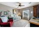 Comfortable bedroom with neutral walls, a ceiling fan, and a well-lit window at 2188 Cumberland Hill Dr, Henderson, NV 89052