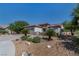 Attractive home with a tile roof, stone accents, and desert landscaping, offering a blend of style and sustainability at 2188 Cumberland Hill Dr, Henderson, NV 89052