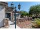 Inviting front entrance showcasing a stone accent wall, wrought iron gate, and desert-friendly landscaping at 2188 Cumberland Hill Dr, Henderson, NV 89052