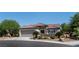 Charming single-story home with a two-car garage, desert landscaping, and a tile roof at 2188 Cumberland Hill Dr, Henderson, NV 89052