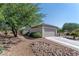 Attached two-car garage and desert landscaping, offering a blend of style and sustainability at 2188 Cumberland Hill Dr, Henderson, NV 89052