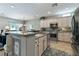 Kitchen with stainless steel appliances and eat-in breakfast bar at 2188 Cumberland Hill Dr, Henderson, NV 89052