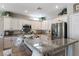 Modern kitchen with granite countertops, stainless steel appliances, and ample cabinet space at 2188 Cumberland Hill Dr, Henderson, NV 89052