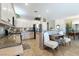 Bright kitchen with white cabinets, granite counters, and stainless steel appliances at 2188 Cumberland Hill Dr, Henderson, NV 89052