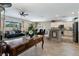 Open-concept living room featuring tile floors, neutral walls, and ceiling fan at 2188 Cumberland Hill Dr, Henderson, NV 89052